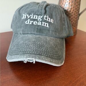 Brand new “Living the Dream” hat with intentional distressing
